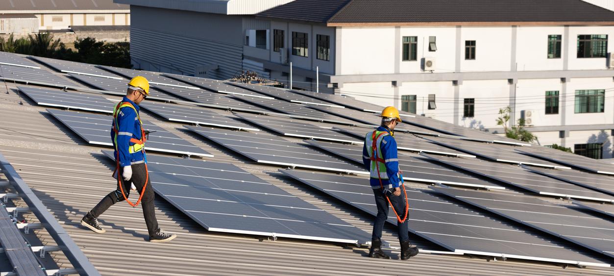 two men and solar panels