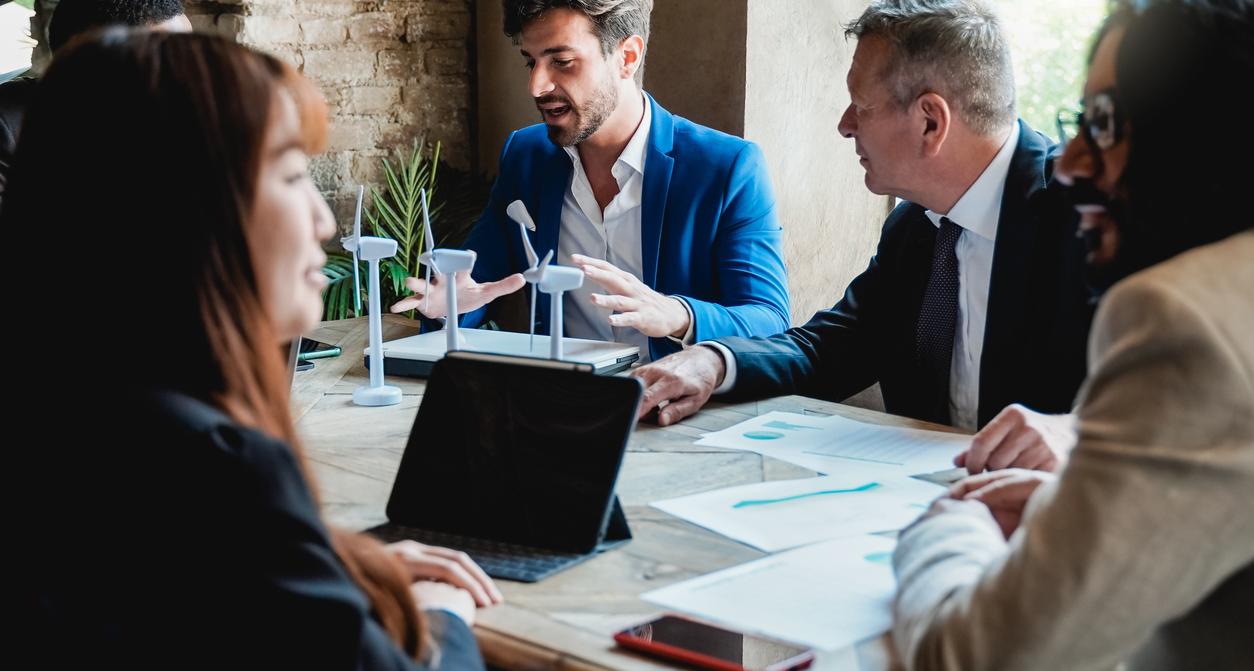 A group of business people around a table