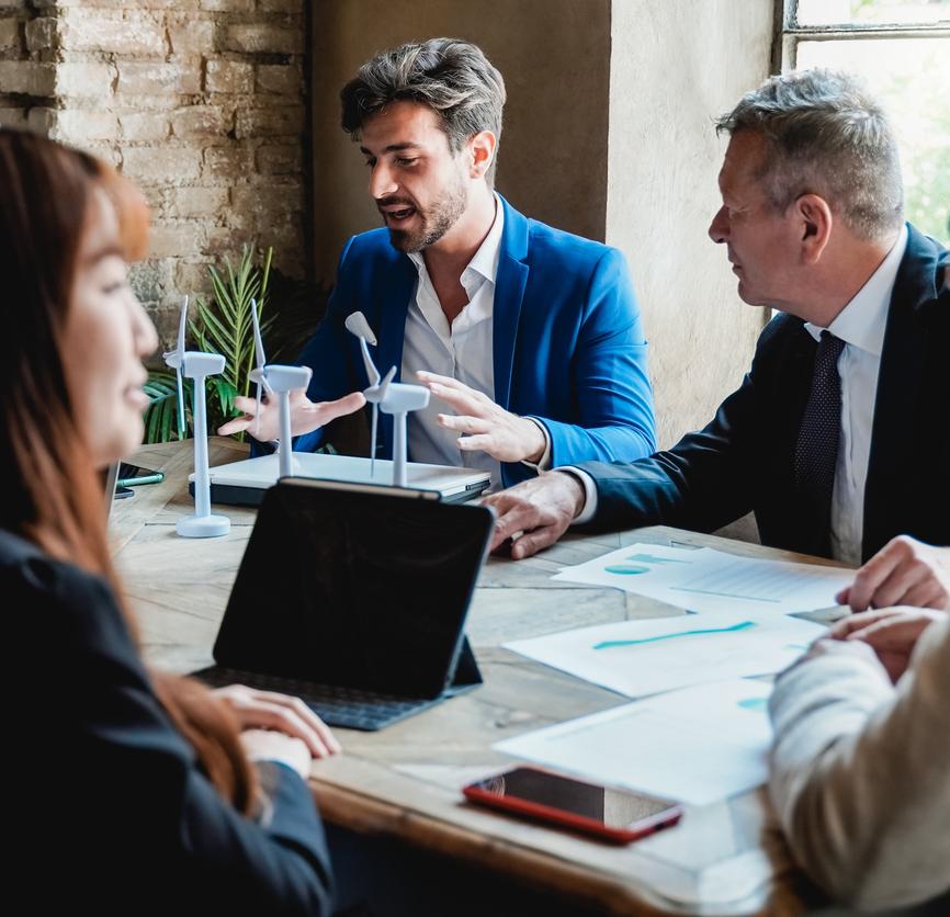 A group of business people around a table