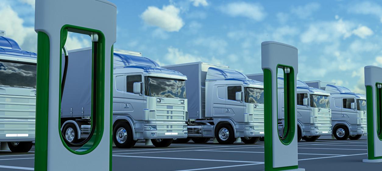 Trucks at an EV charging station