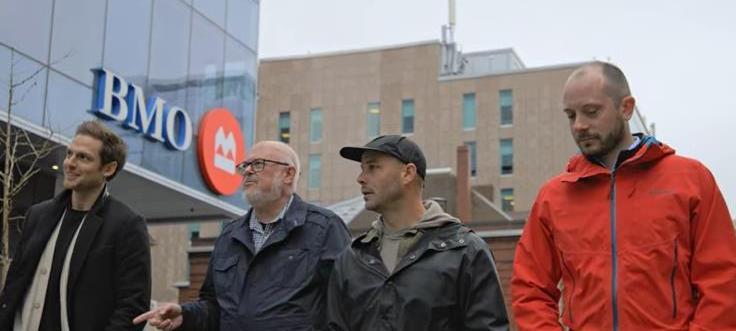 four men standing