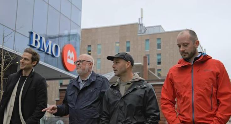 four men standing